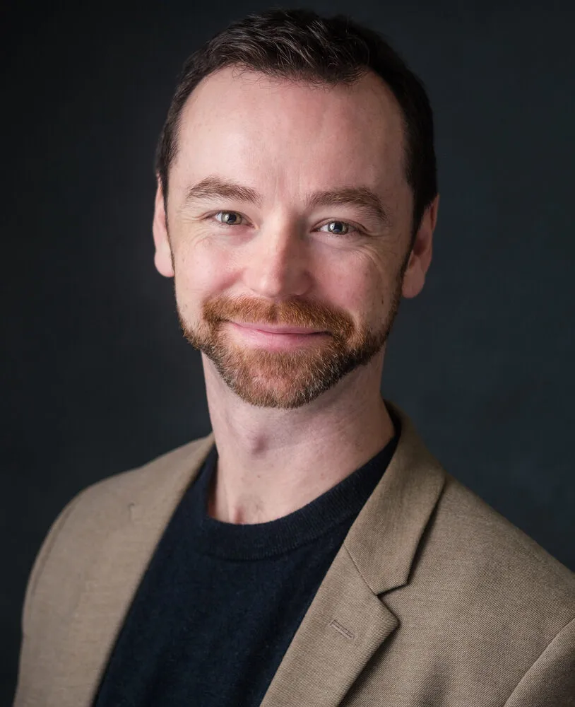 dr. chris pickrell headshot against black background