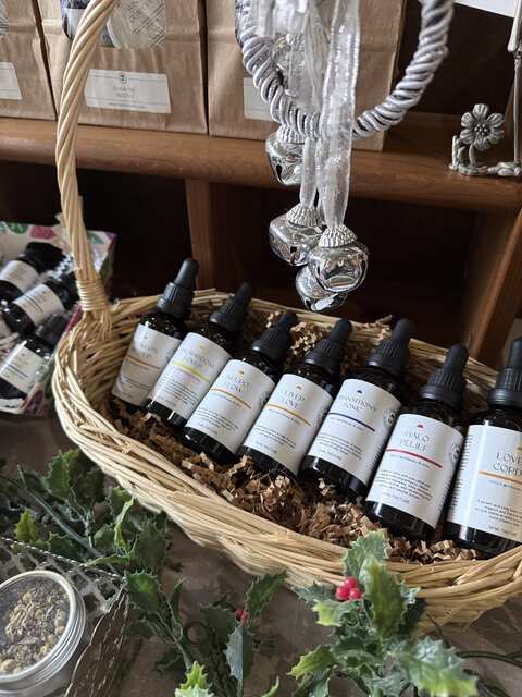 herbal tincture blend displayed in holiday basket